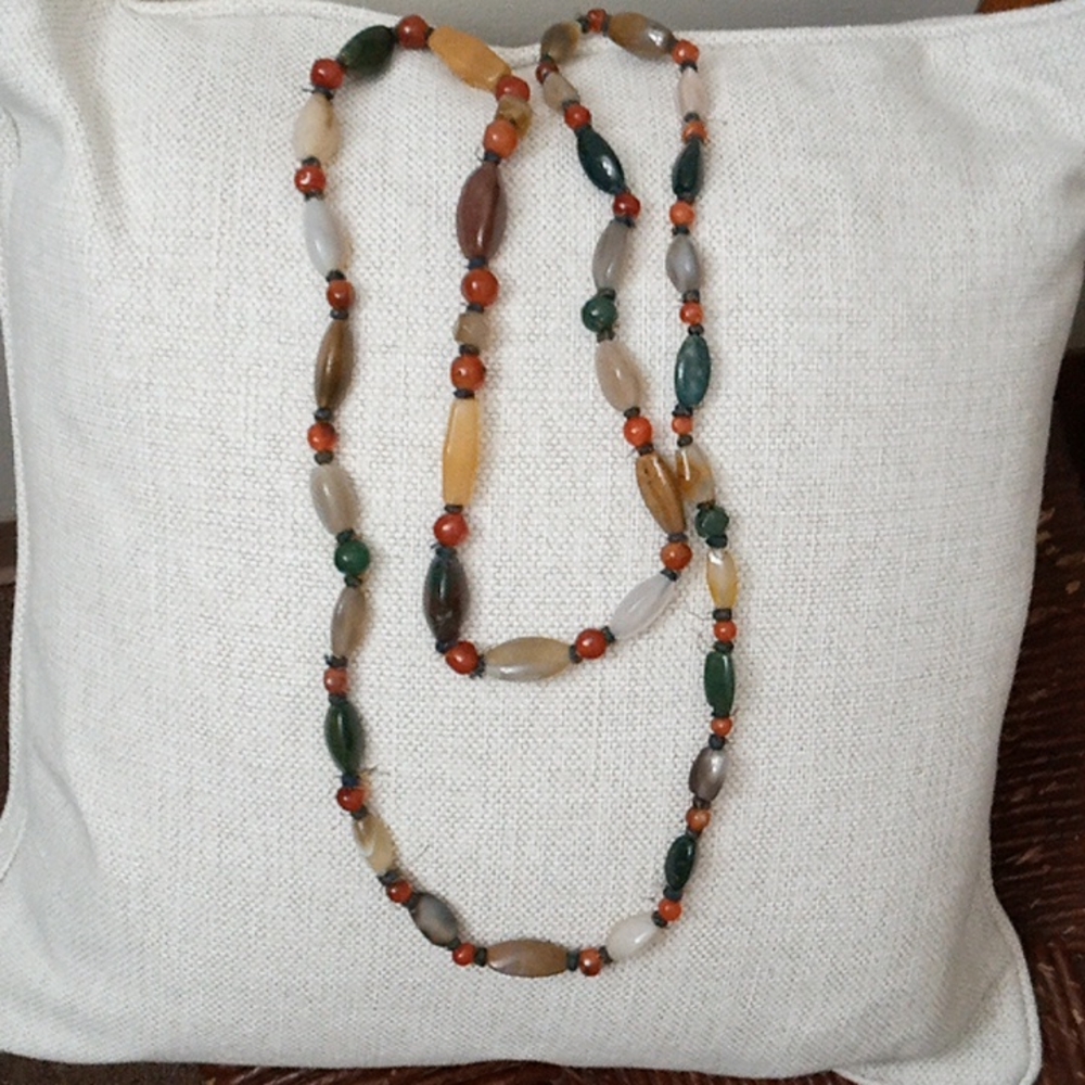 I am selling a handmade crystal necklace that's approximately 123 inches long.